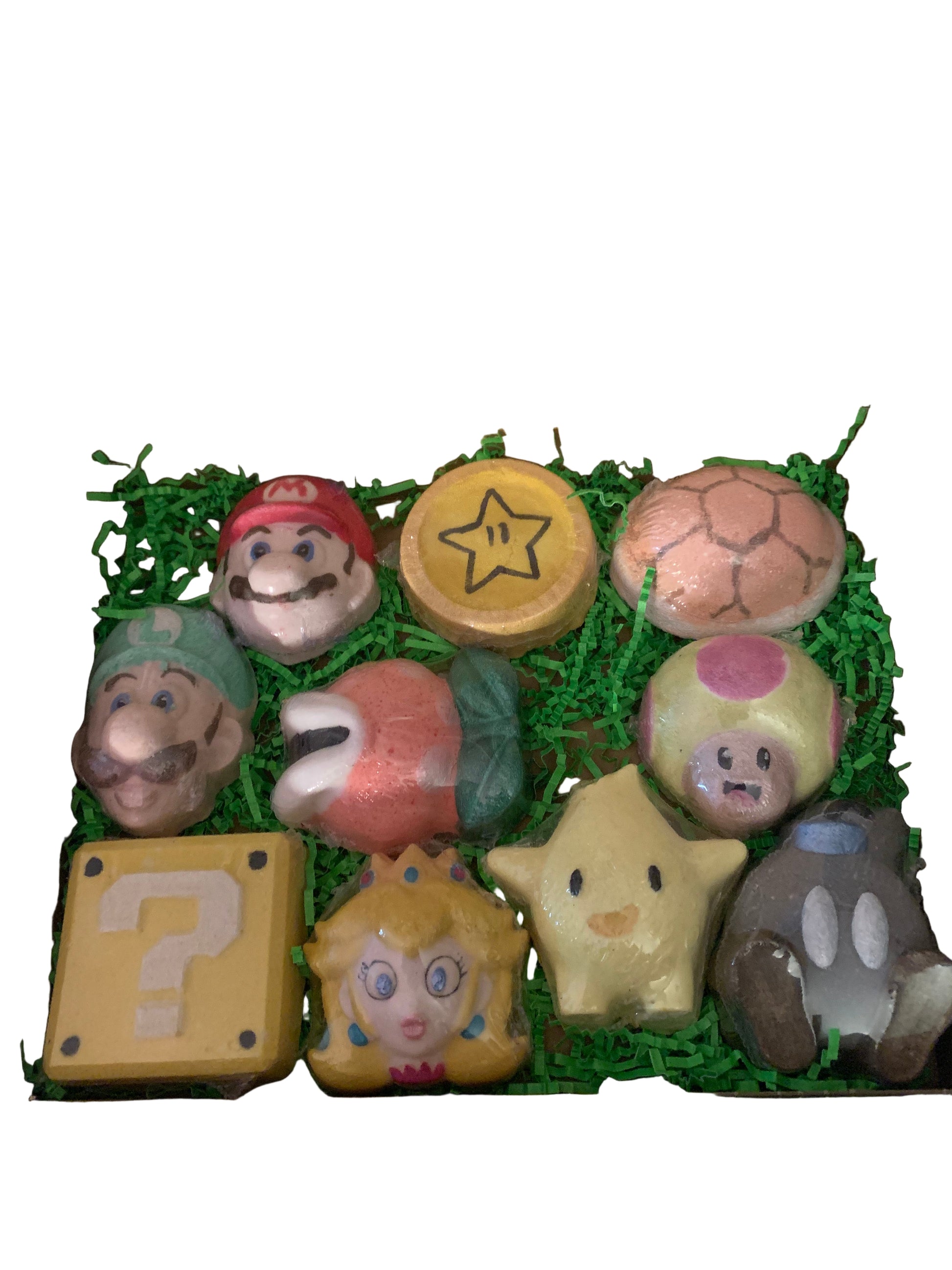 A variety of colorful bath bombs with Super Mario characters inside, arranged neatly in an open gift box.