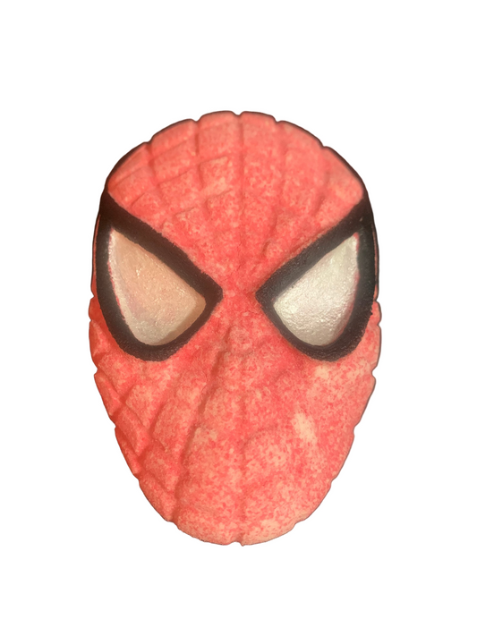 A large red bath bomb designed to look like a spider with a human face in the center, resembling a superhero or comic book character.